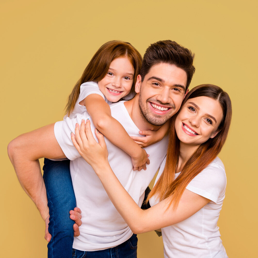 Nice Cheerful Smiling Family Of Three